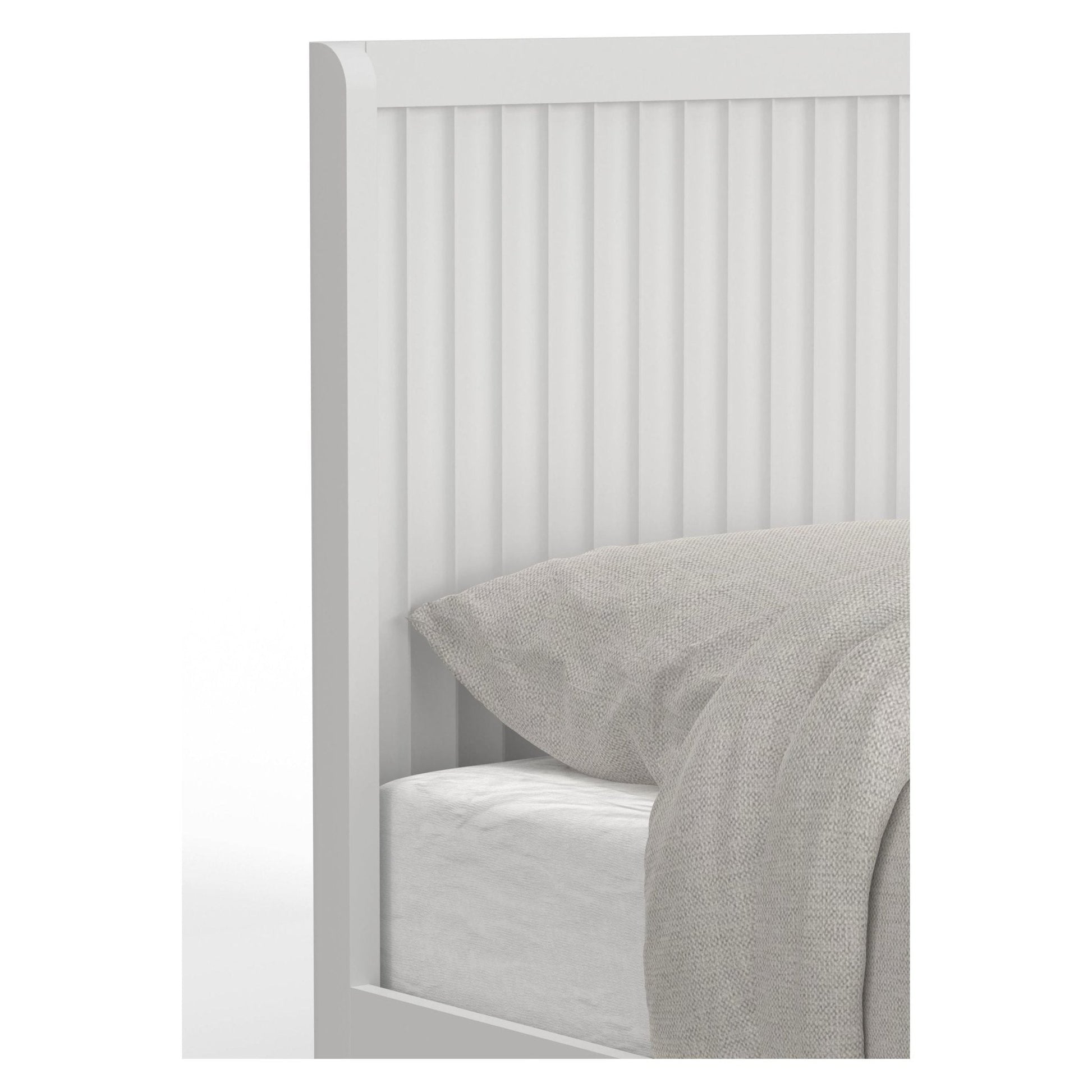 Close-up of Stapleton Panel Bed headboard featuring vertical slats and neutral bedding.