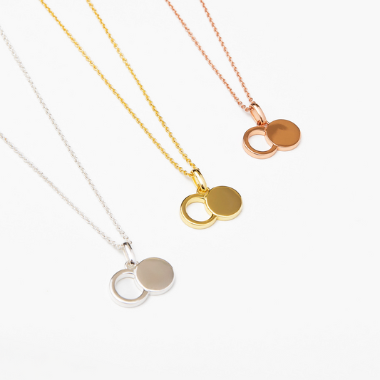 The Empty Tomb Pendant Necklace featuring three metal finishes: silver, gold, and rose gold.