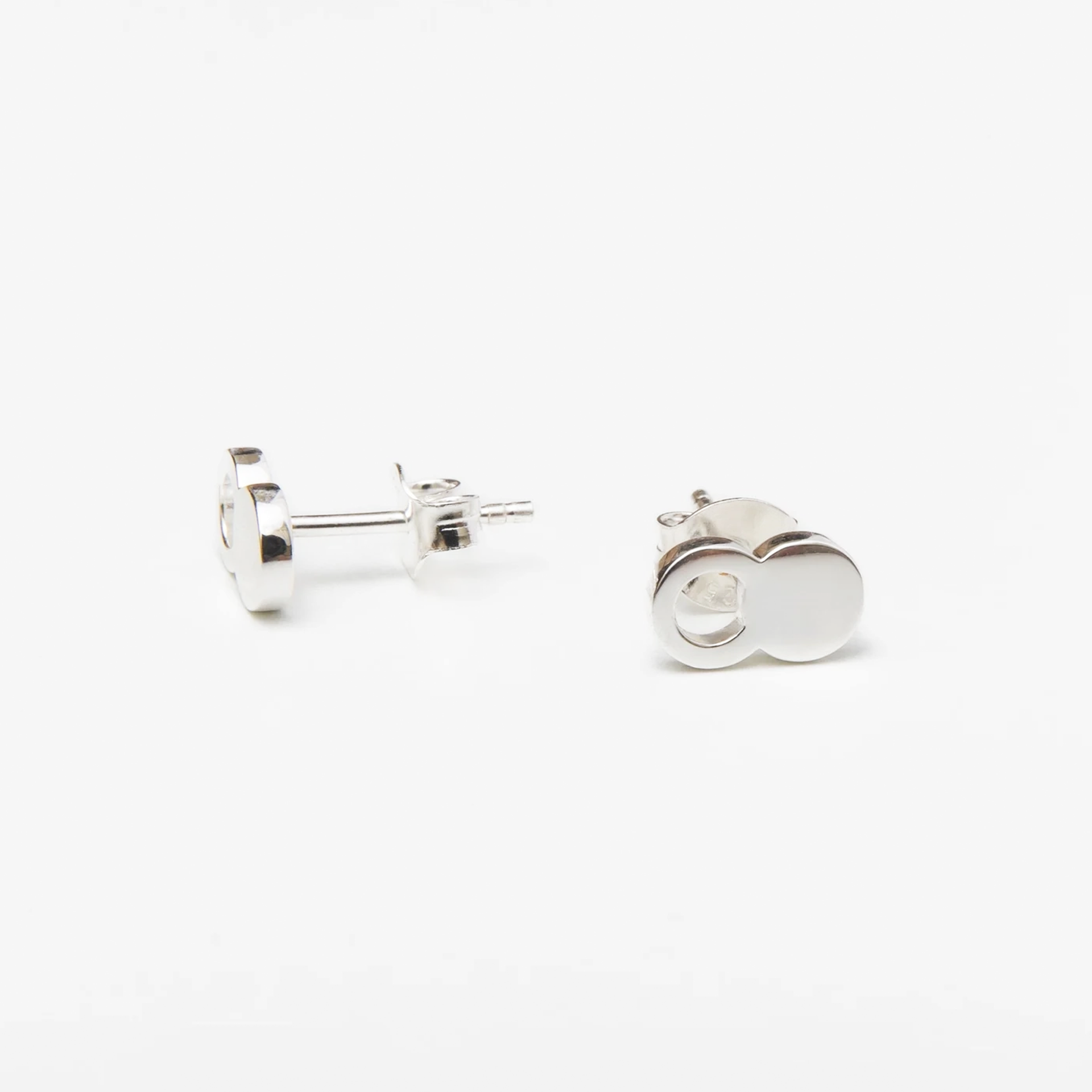 The Empty Tomb Stud Earrings showcasing a stylish and symbolic design, perfect for reminders of faith.