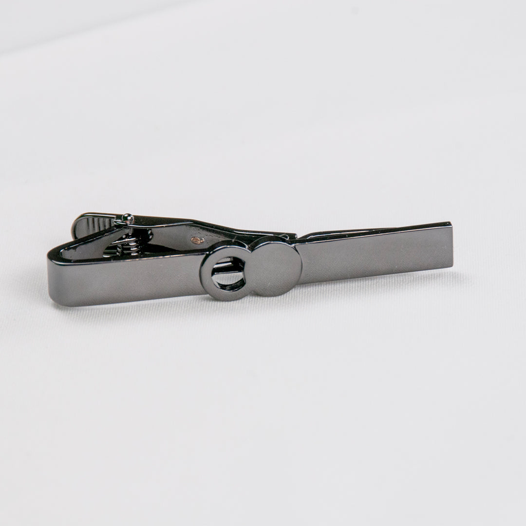 The Empty Tomb Tie Clip featuring a sleek brass design for formal attire.