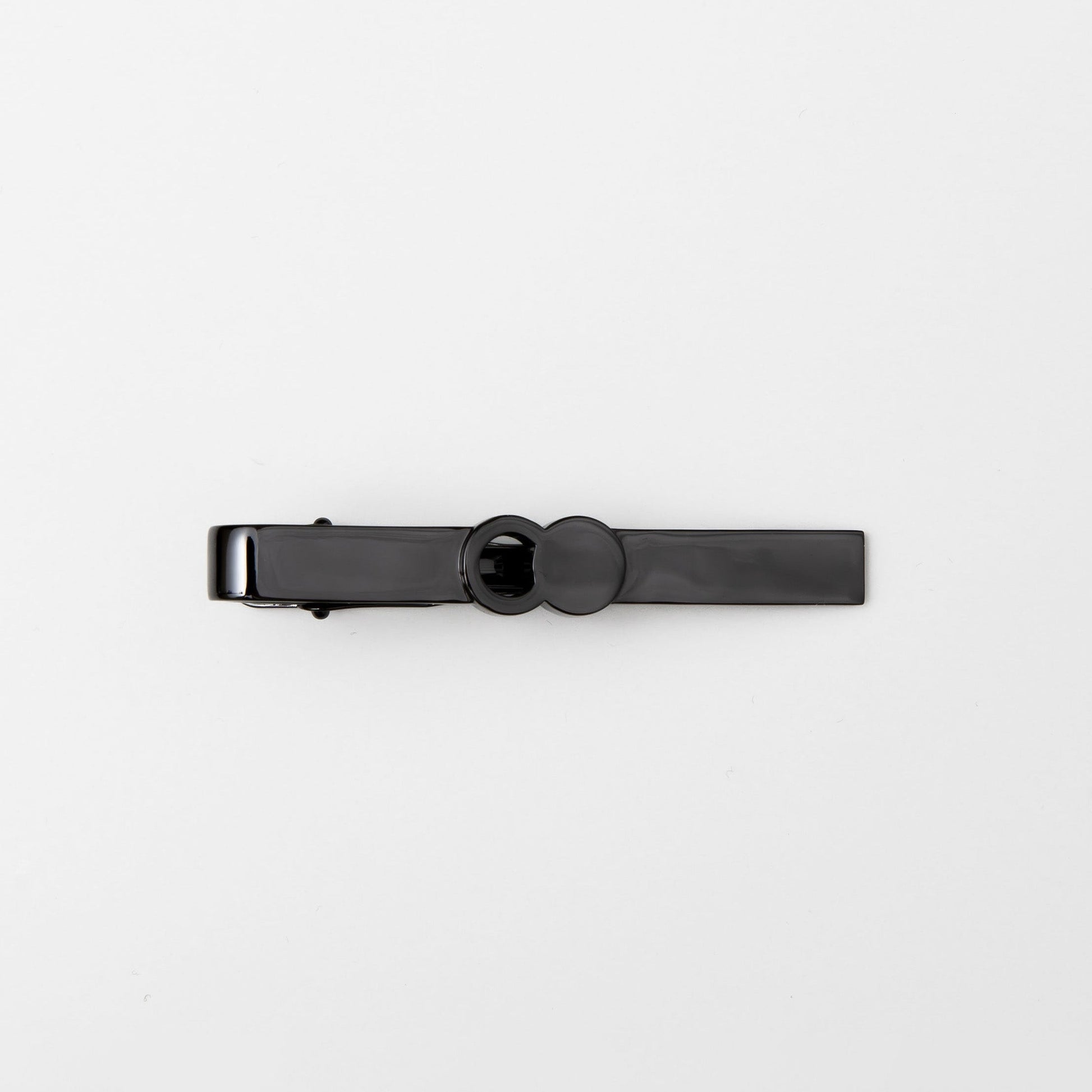 The Empty Tomb Tie Clip in sleek black design, perfect for enhancing formal attire with style.