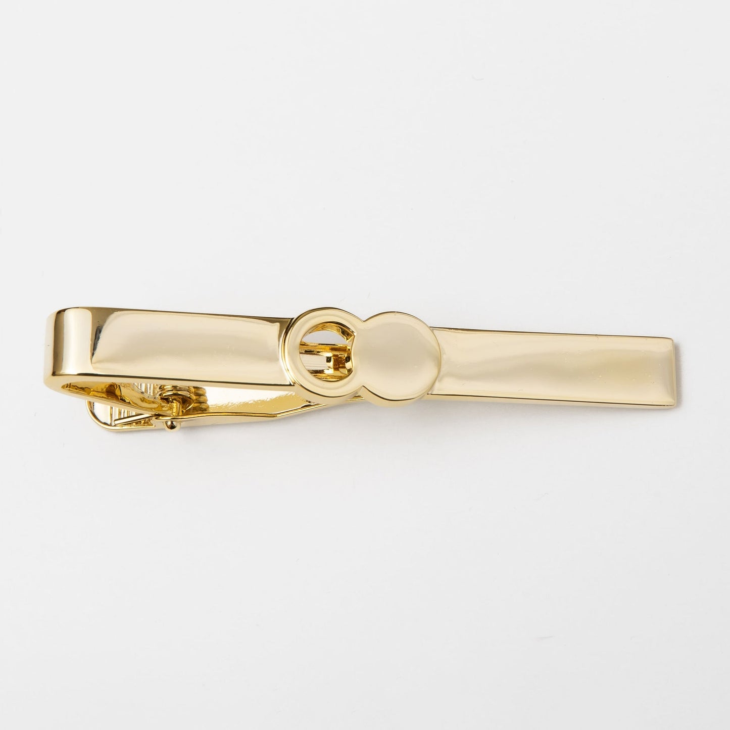 The Empty Tomb Tie Clip, a sleek brass tie clip showcasing functionality and style for formal attire.