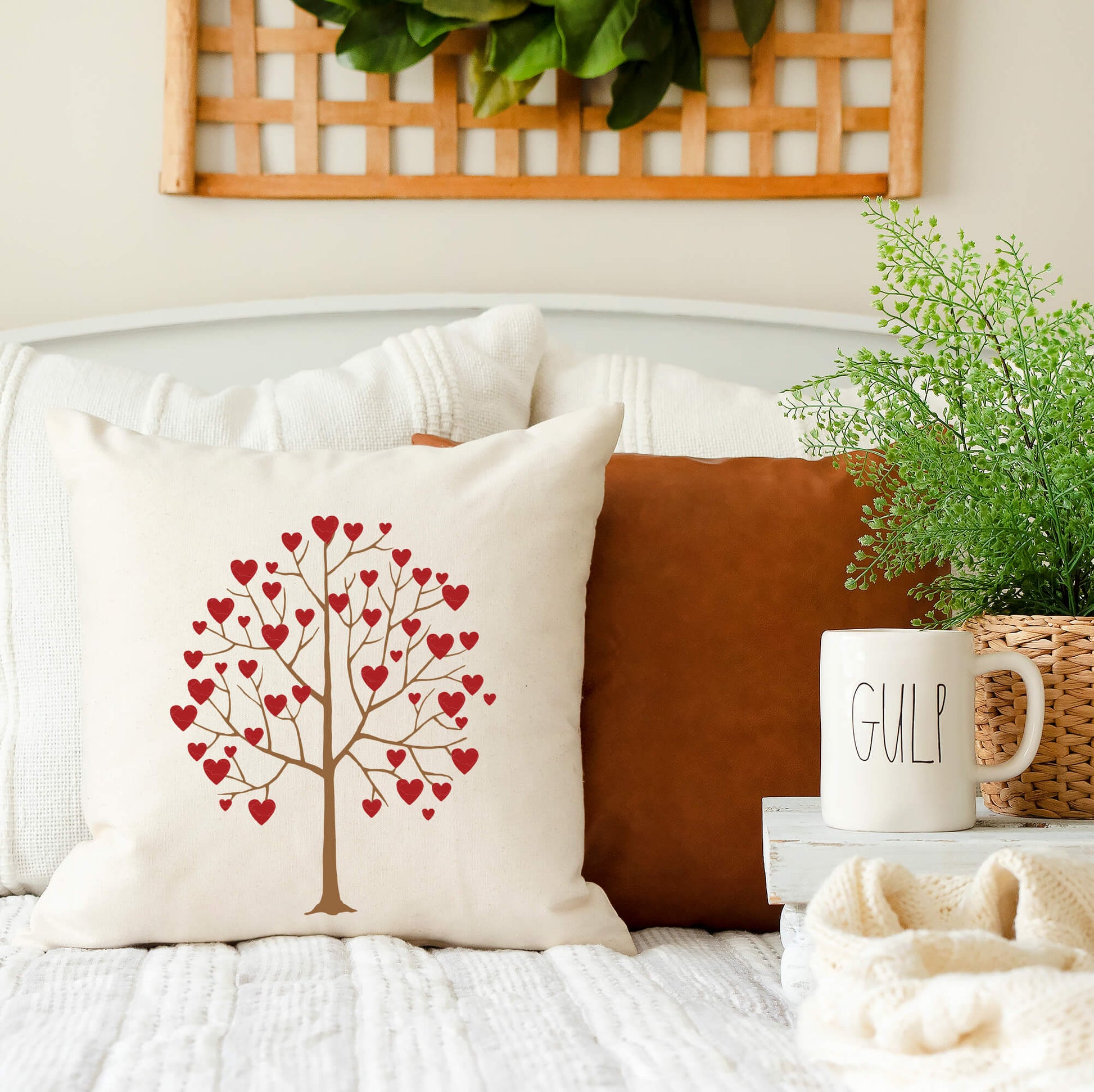 Valentine Tree with Hearts Valentine's Day Pillow Cover 18x18 displayed on a couch with decorative elements.
