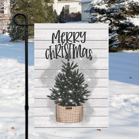 Tree In Basket Christmas Garden Flag featuring a snowy background and festive design, perfect for seasonal outdoor decoration.