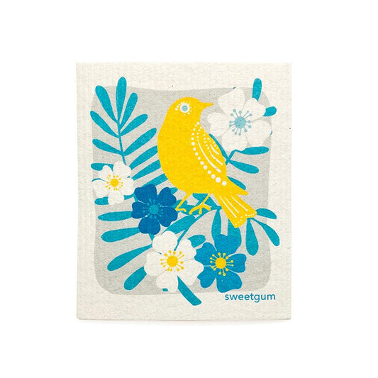 Yellow Bird Swedish Dishcloth featuring a bright yellow bird and colorful flowers on an absorbent surface.